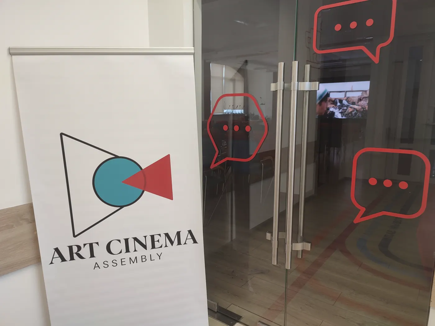 Art Cinema Assembly banner and glass entrance to the venue