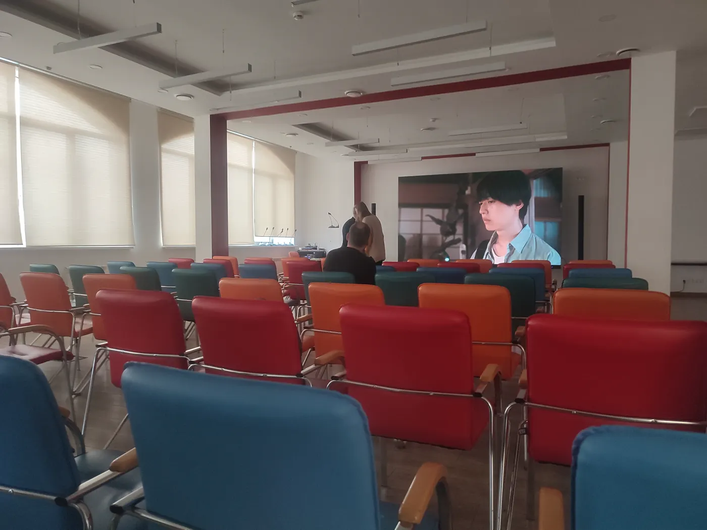 Audience seated in the screening room during an Art Cinema Assembly presentation